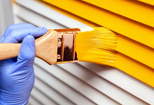 Brushing enamel on door trim and shutters